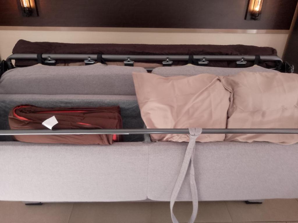 Ένα ή περισσότερα κρεβάτια σε δωμάτιο στο ANTIQUA ROMA - via temporis CXIV