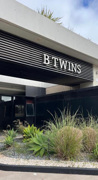 a building with a sign that reads bernills at Btwins Pinamar in Pinamar