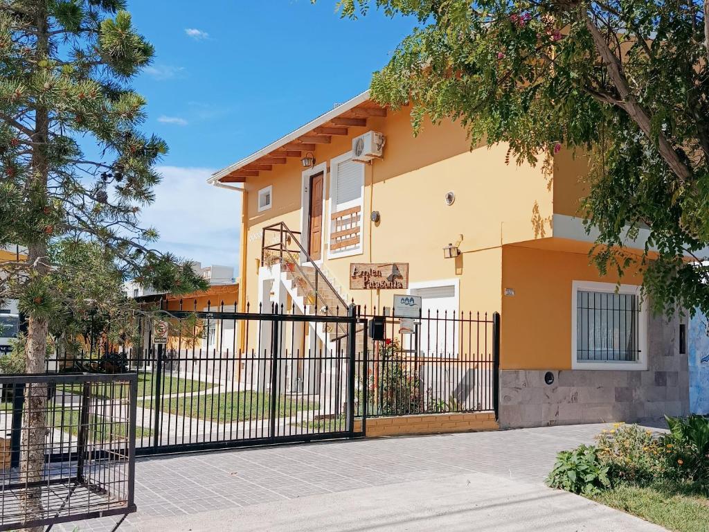a house with a gate in front of it at Amien Patagonia in Puerto Madryn