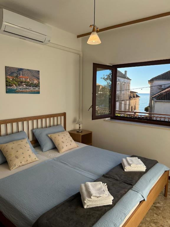 Ένα ή περισσότερα κρεβάτια σε δωμάτιο στο VM Apartments