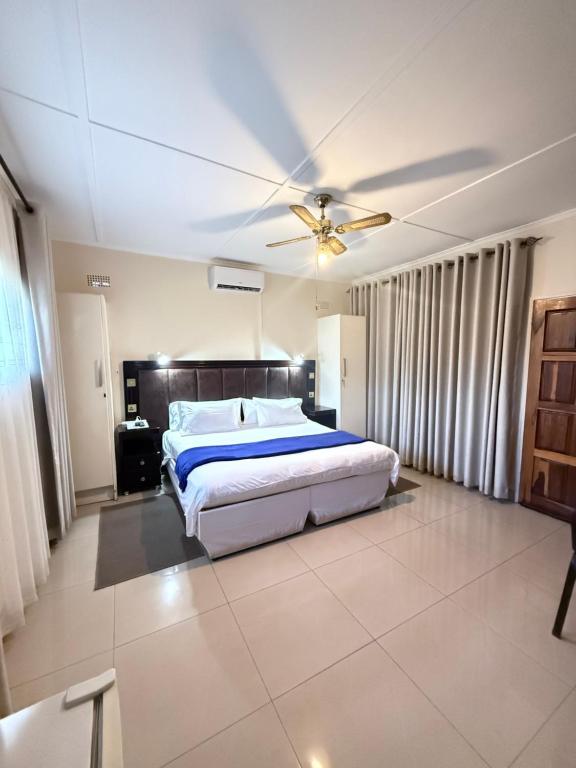 Ένα ή περισσότερα κρεβάτια σε δωμάτιο στο Villa Thabiso