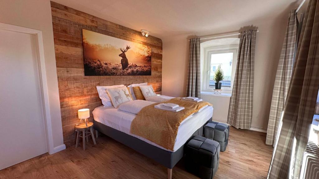 En eller flere senge i et værelse på Landhaus Vorderberg - Appartementen