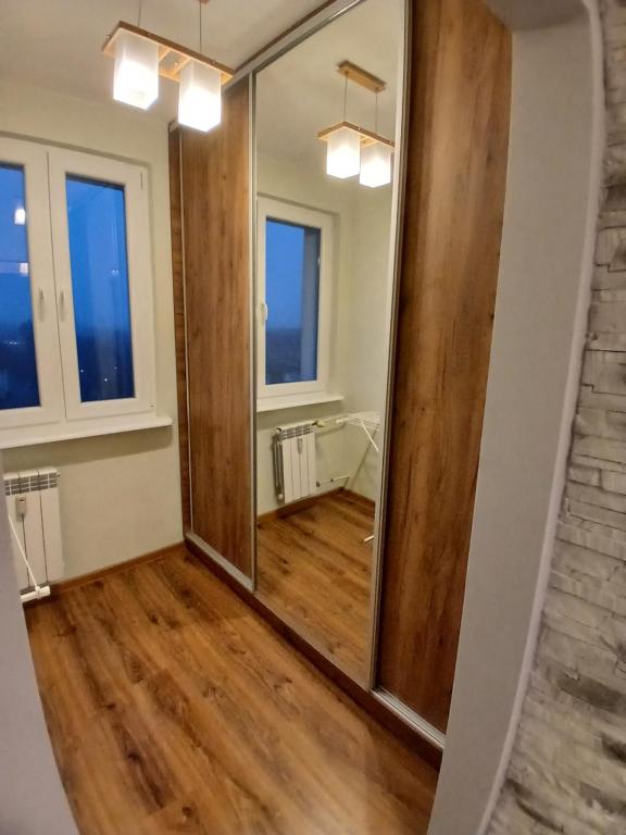 a mirror in the hallway of a home at Apartament Piła Wita in Piła
