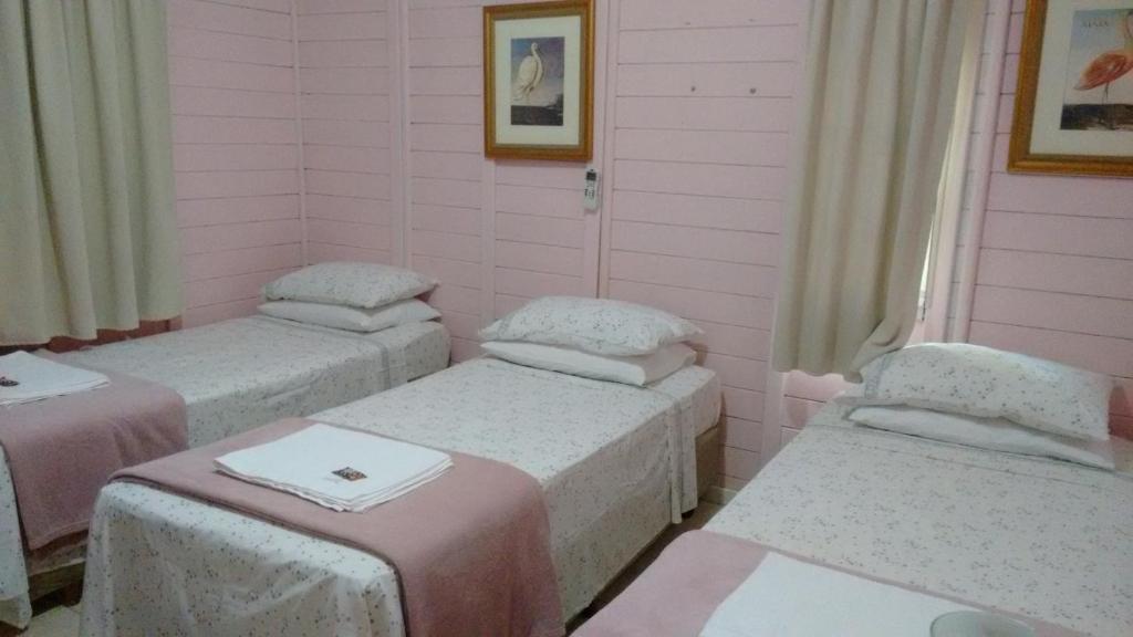 Postel nebo postele na pokoji v ubytování Pousada das Gêmeas