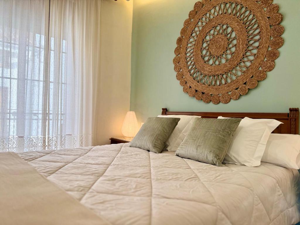 Ένα ή περισσότερα κρεβάτια σε δωμάτιο στο A R Benjamín