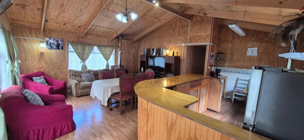 a living room with a kitchen and a living room with at Casa patagonia in Cochrane