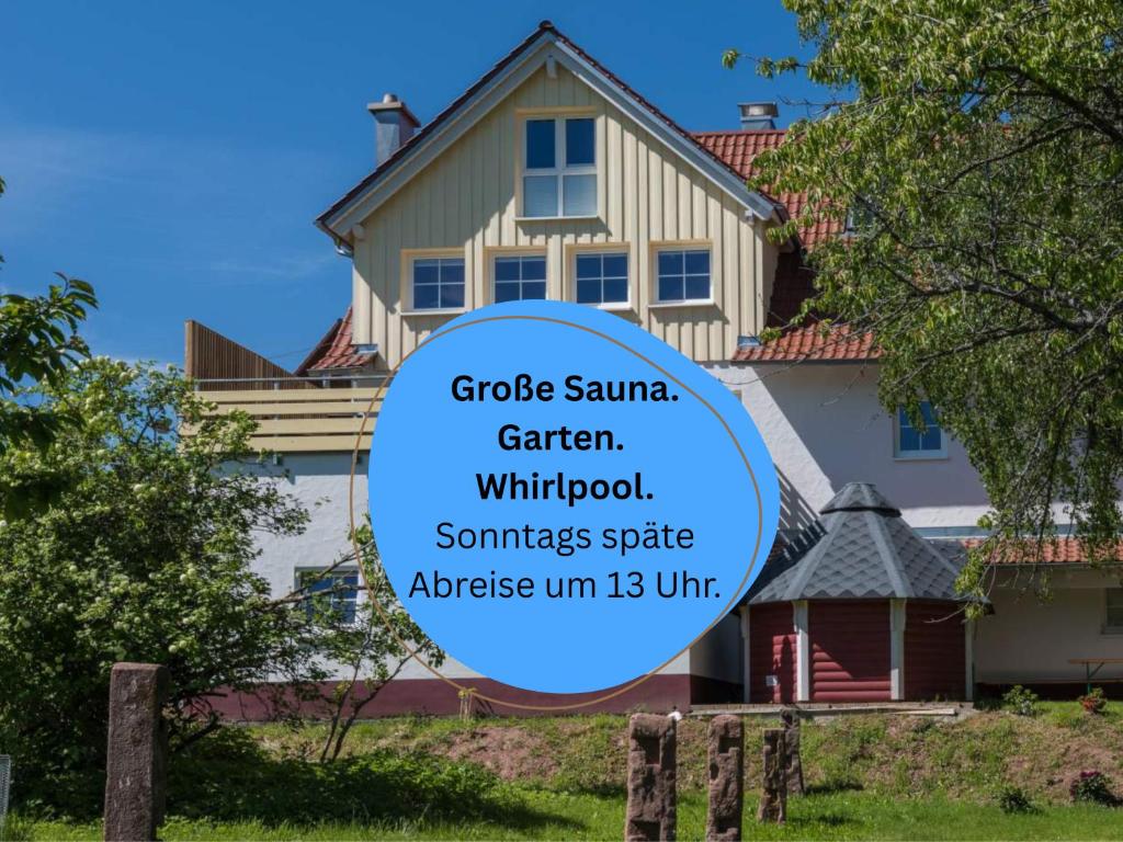 a house with a sign that reads grote square garden garden withholdood summersete at Landhaus Seewald: Große Sauna, Garten | See 5 Min. | 20 Personen in Seewald