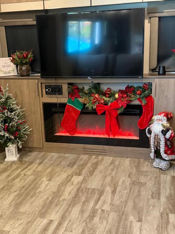 a living room with a fireplace with christmas decorations at Paradise in Tampa