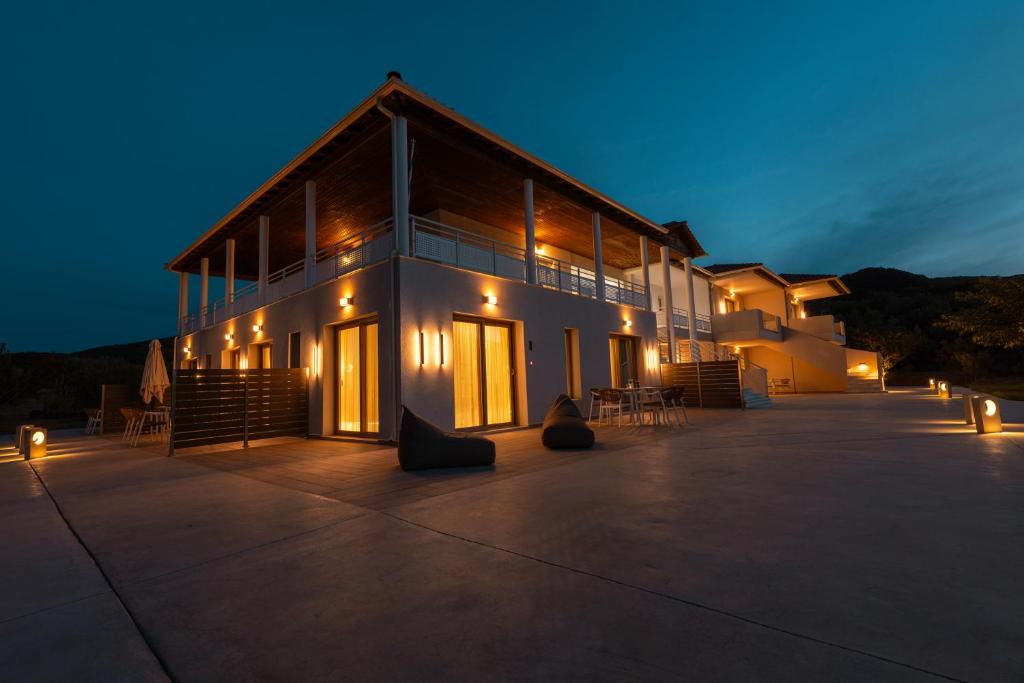 a large building with lights on it at night at Thrive in Sarti