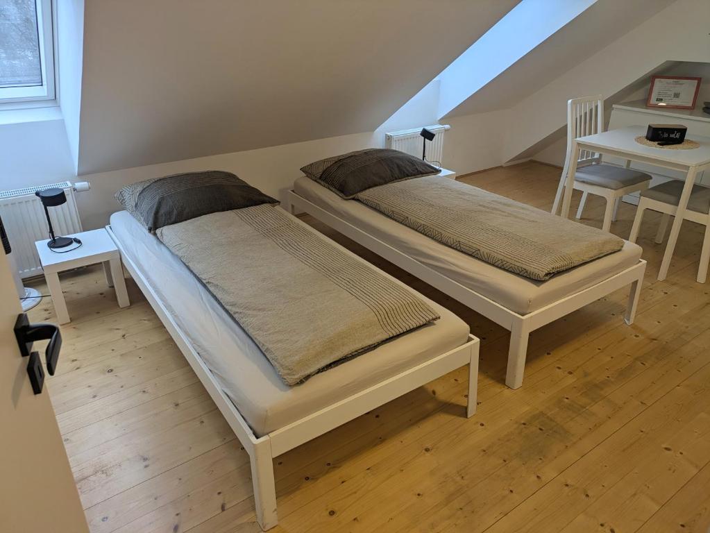 En eller flere senge i et værelse på Ubytování u zámku