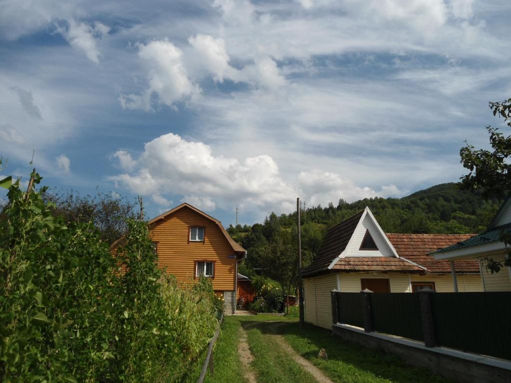 a small town with a train on the tracks at Holiday home Lancedor in Yaremche