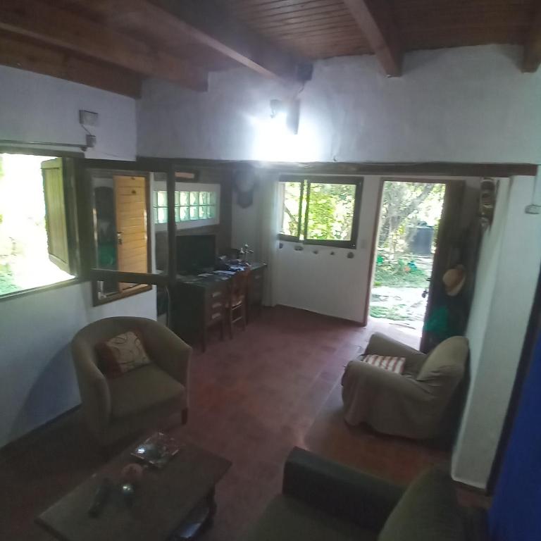 a living room with a couch and a table at El ceibo in Agua de Oro