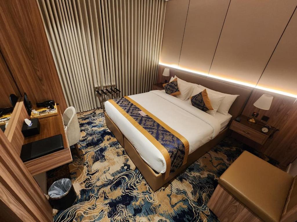 Ένα ή περισσότερα κρεβάτια σε δωμάτιο στο بيوت عطلات منزال الجبل