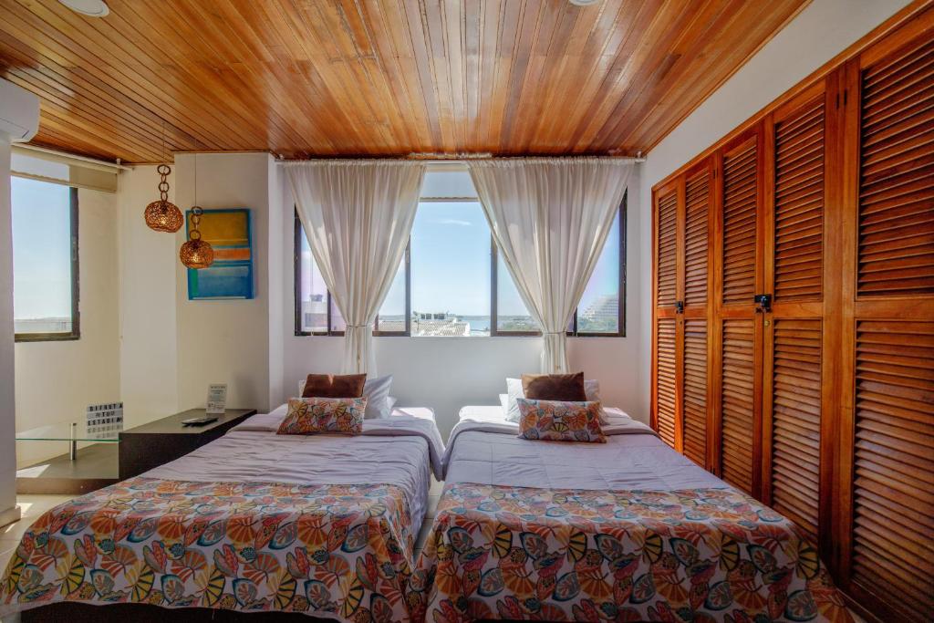 Ένα ή περισσότερα κρεβάτια σε δωμάτιο στο Habitación para 3 a una cuadra de la playa y bahía