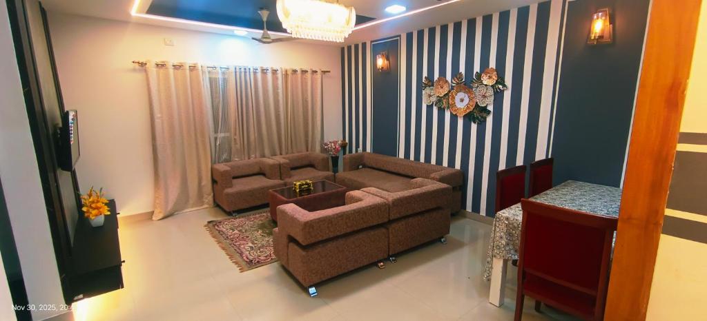 a living room with a couch and a table at GK appartments in Bengaluru