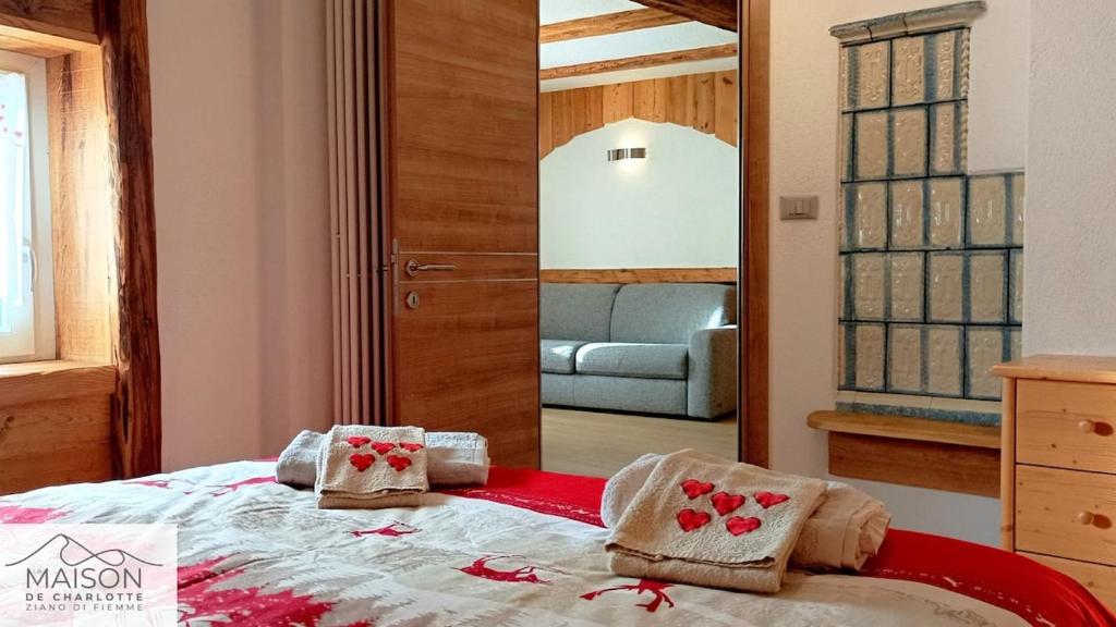En eller flere senge i et værelse på La Maison de Charlotte - Val di Fiemme