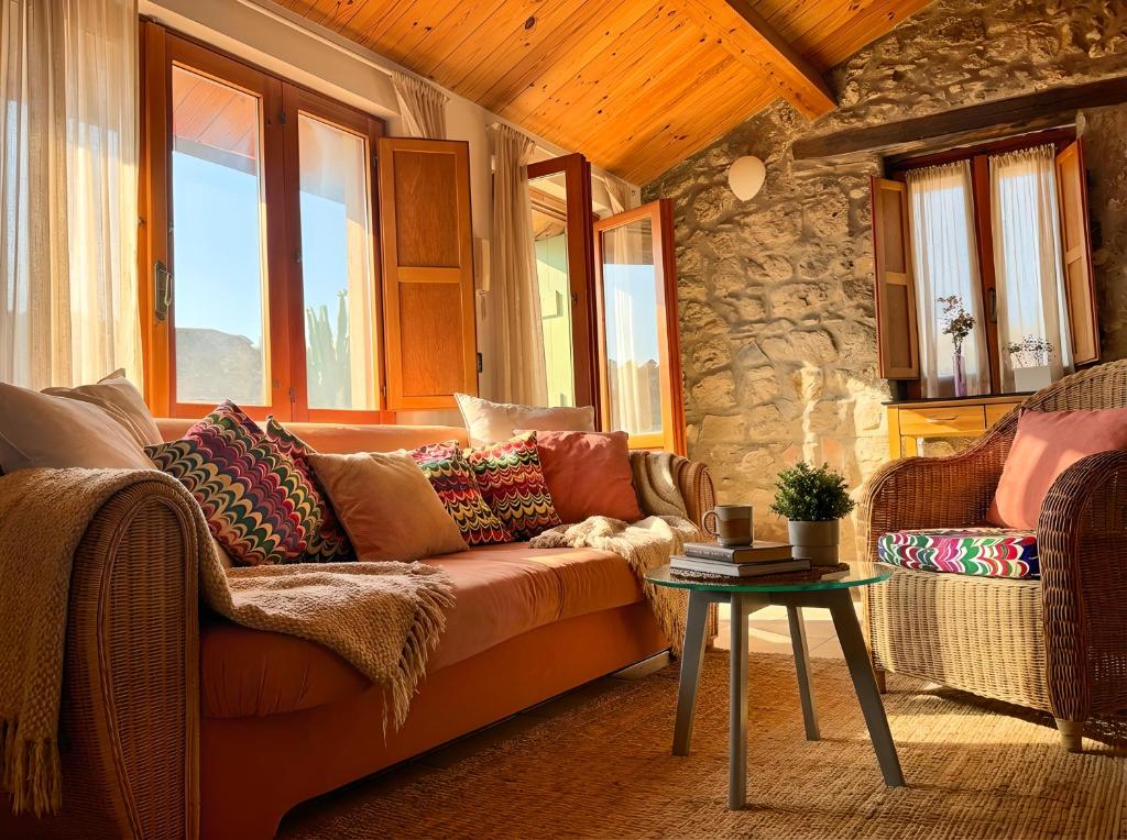 a living room with a couch and a table at Attico con vista unica in Scalea