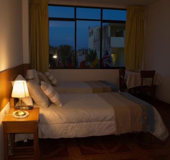 Ένα ή περισσότερα κρεβάτια σε δωμάτιο στο Casa del Huesped - Guest House