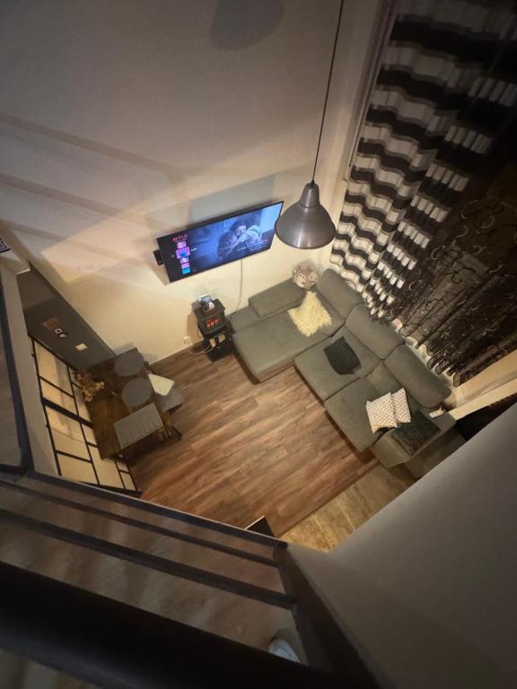 an overhead view of a living room with a flat screen tv at Madrid Loft duplex in Madrid