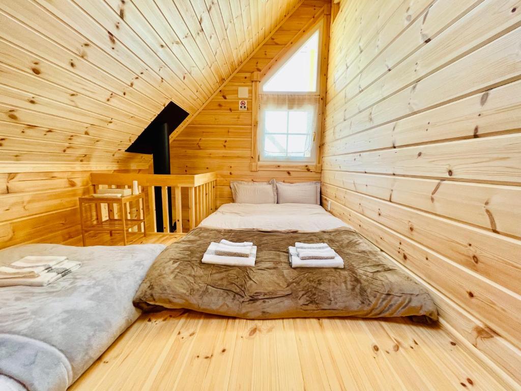 Ένα ή περισσότερα κρεβάτια σε δωμάτιο στο 山中湖レイクサイド1号館