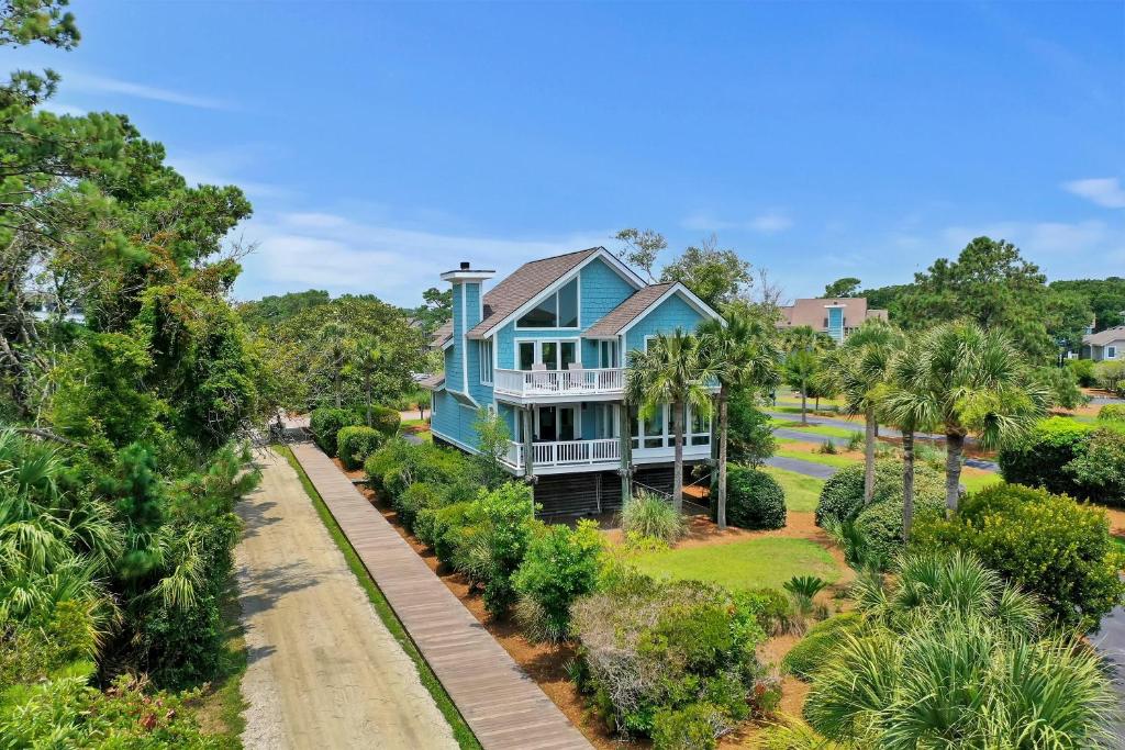 an aerial view of a blue house with palm trees at RD2224: 2224 Rolling Dune in Seabrook Island