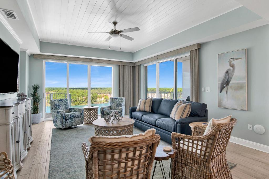 a living room with a couch and chairs at The Wharf 701 in Orange Beach