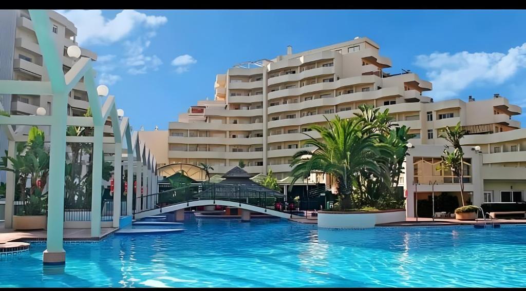 a view of a resort with a swimming pool at Relax Beach in Benalmádena