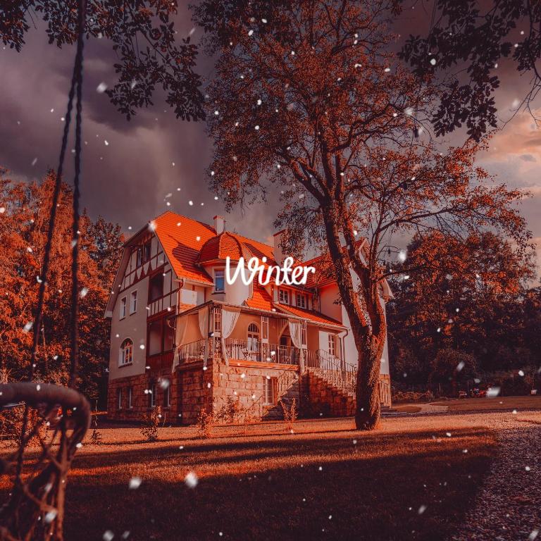 a building with a winter sign on top of it at Sonnenblick in Polanica-Zdrój