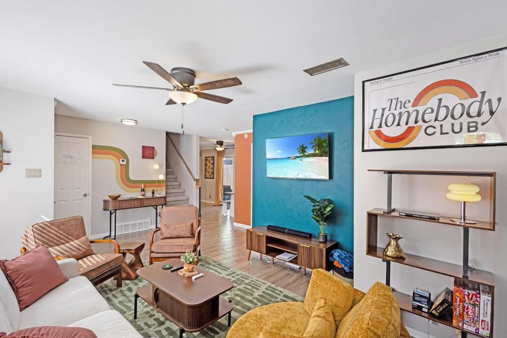 a living room with a white couch and a living room at 5 min to AT&T Stadium, Game Room, Huge Yard in Arlington