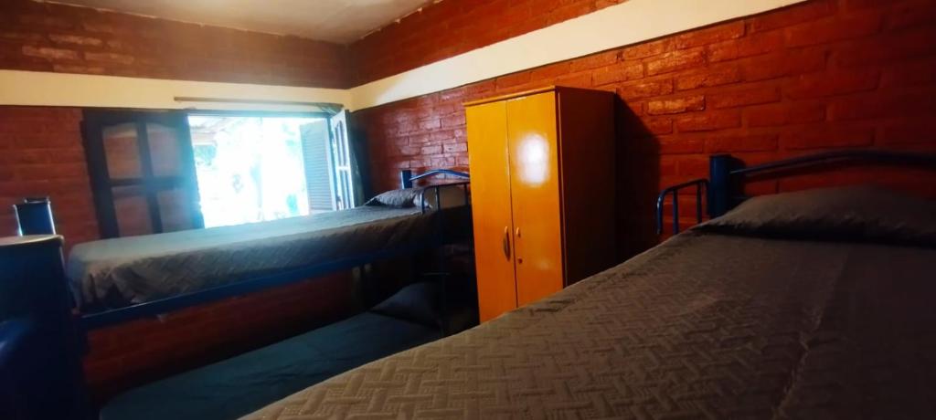 Ένα ή περισσότερα κρεβάτια σε δωμάτιο στο Habitación Compartida Tipo Hostel para los más aventureros