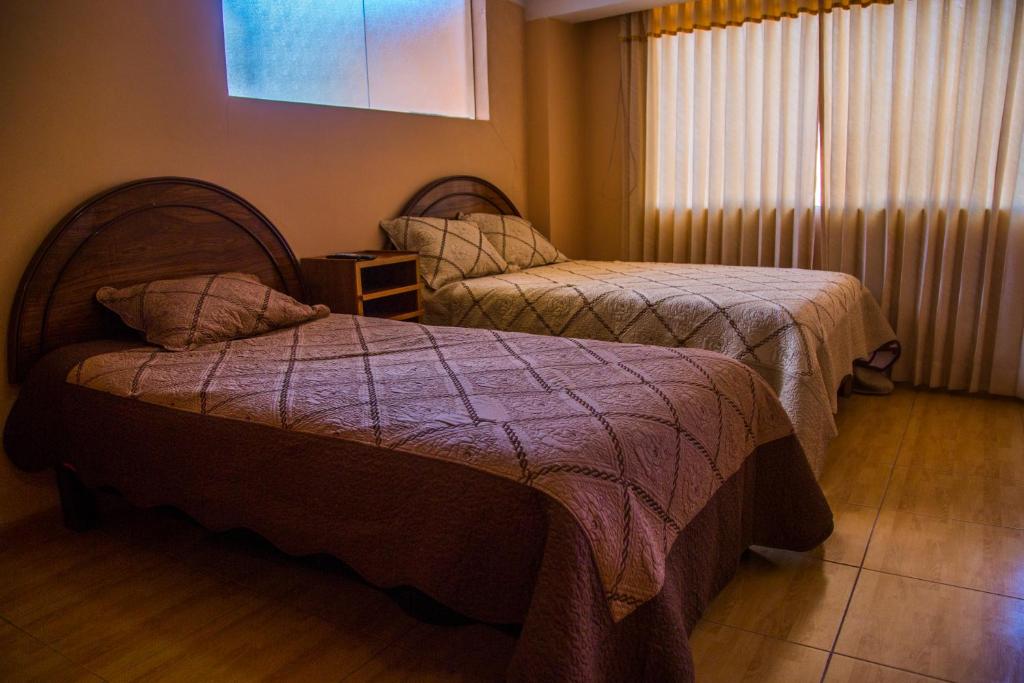 Postel nebo postele na pokoji v ubytování Wisny Inn