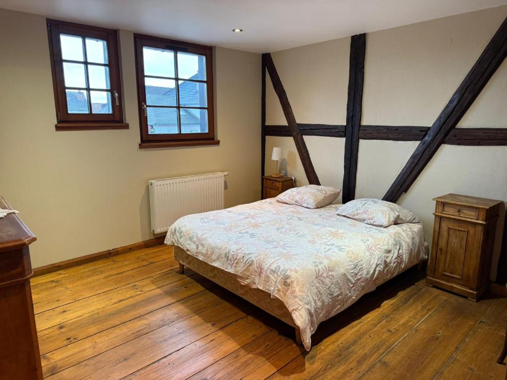 Ένα ή περισσότερα κρεβάτια σε δωμάτιο στο Les Perles du Ried - Gîte 207