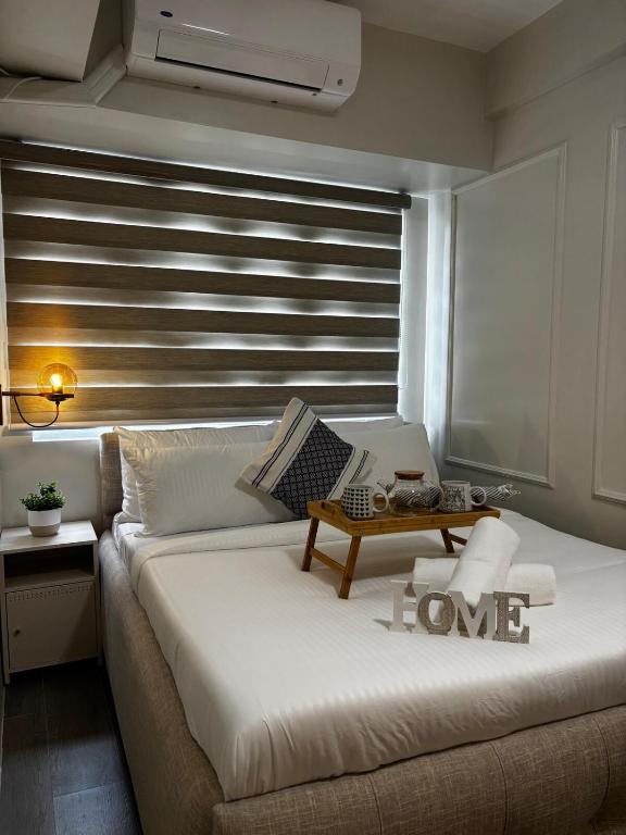 Ένα ή περισσότερα κρεβάτια σε δωμάτιο στο I Simple & Stylish 1BR Living