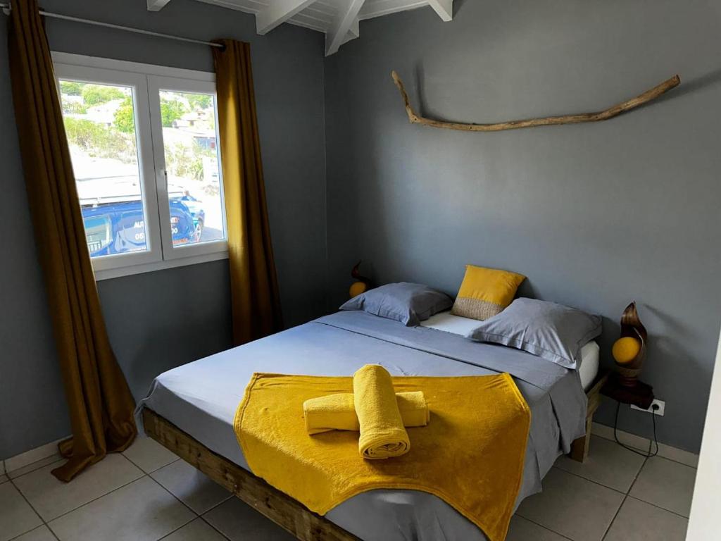 Ένα ή περισσότερα κρεβάτια σε δωμάτιο στο Villa Ékla