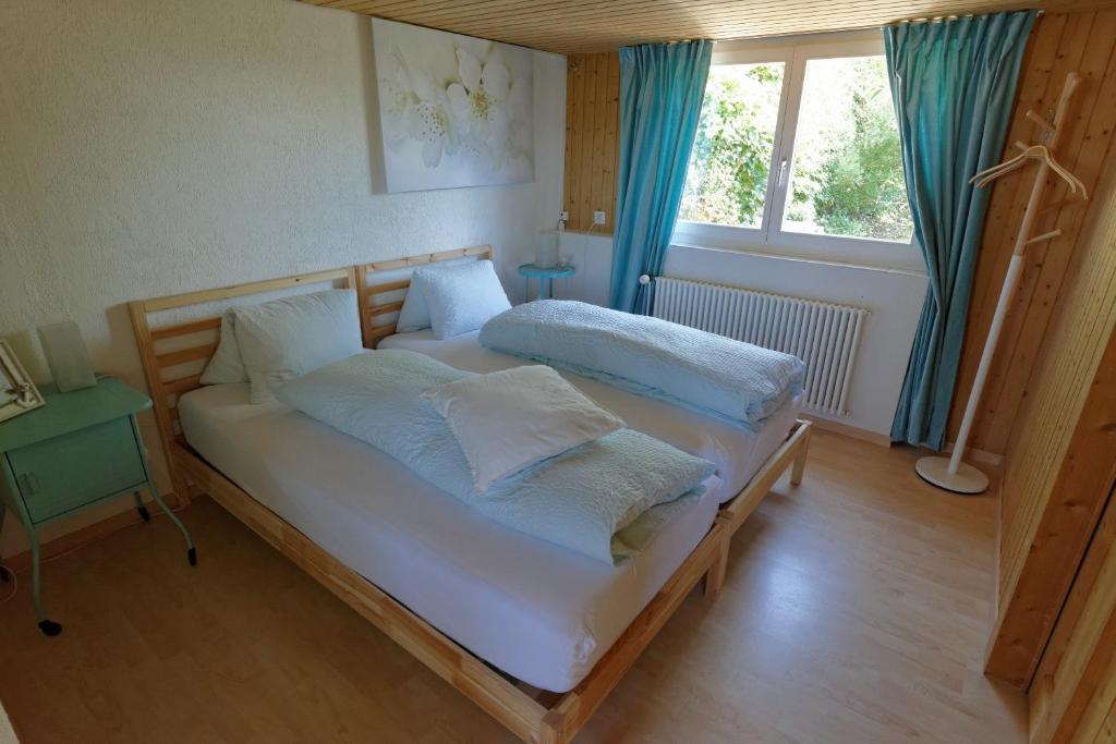 Postel nebo postele na pokoji v ubytování BnB Alpenblick