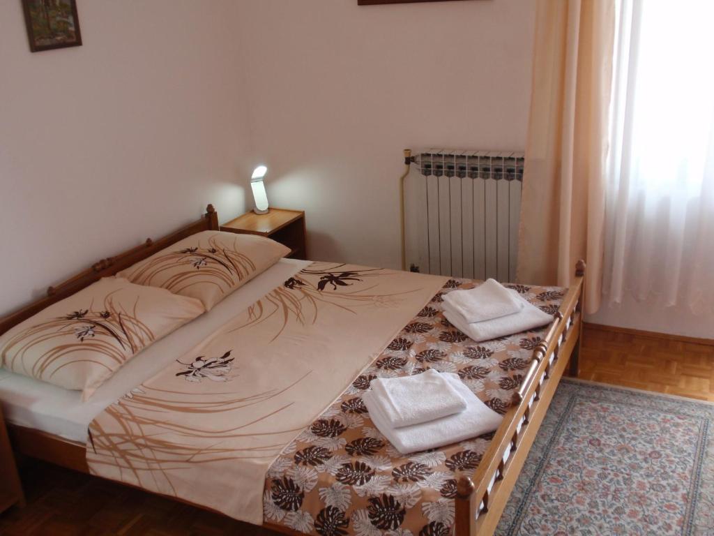 Posteľ alebo postele v izbe v ubytovaní Apartments Maximir