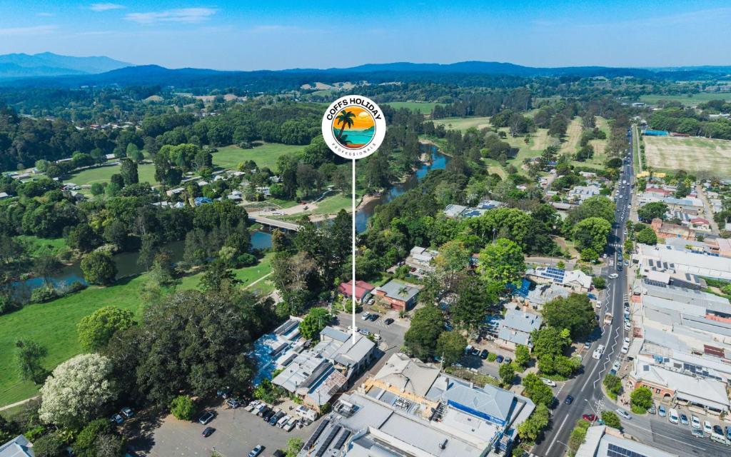 an aerial view of a city with a clock tower at The Nest in Bellingen