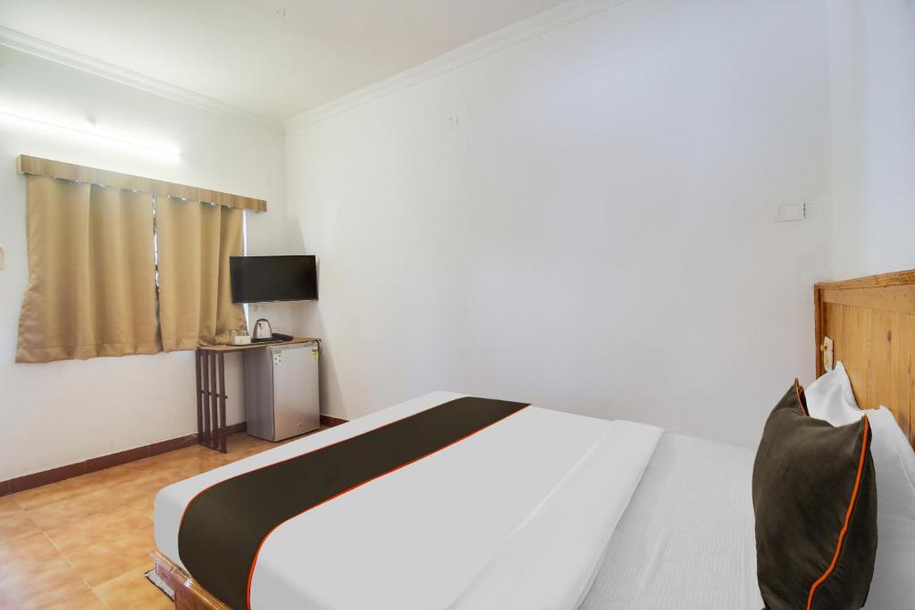 Ένα ή περισσότερα κρεβάτια σε δωμάτιο στο Collection O Bay