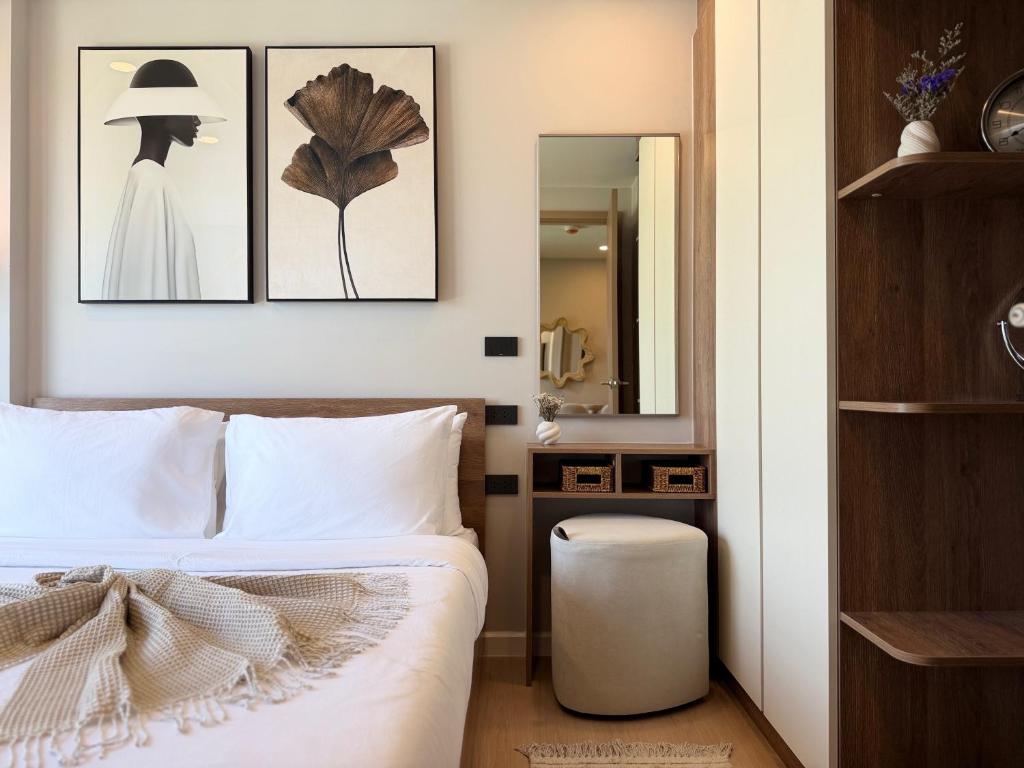 Ένα ή περισσότερα κρεβάτια σε δωμάτιο στο Gloria's Laguna Suite