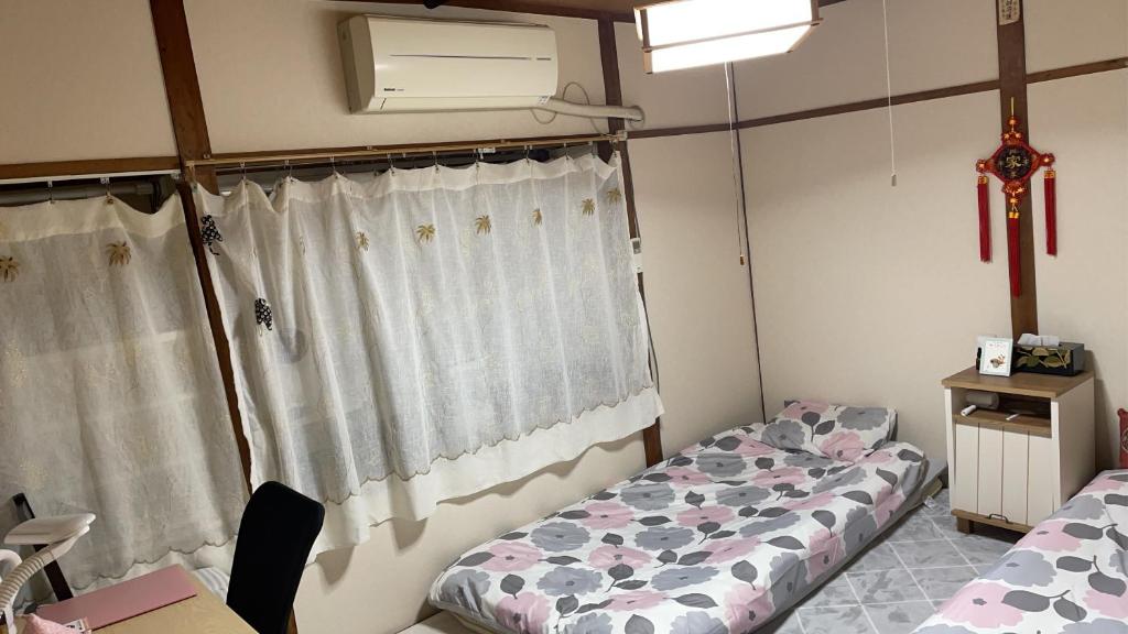 Ένα ή περισσότερα κρεβάτια σε δωμάτιο στο 耀来YoRaiようらい