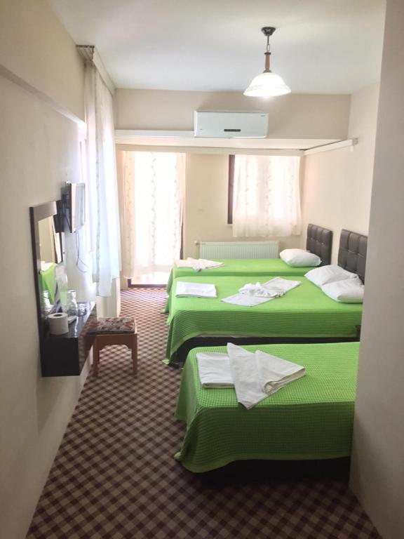 Postel nebo postele na pokoji v ubytování Anatolia Hotel