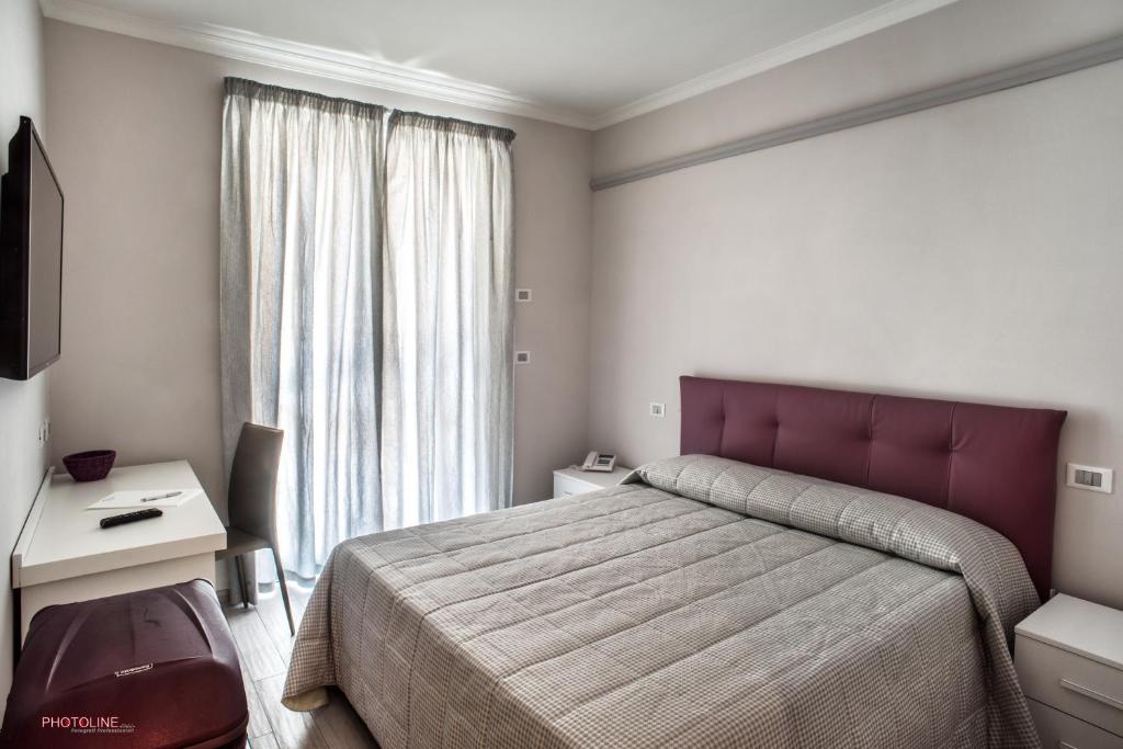 Postel nebo postele na pokoji v ubytování Hotel Villa Giulia