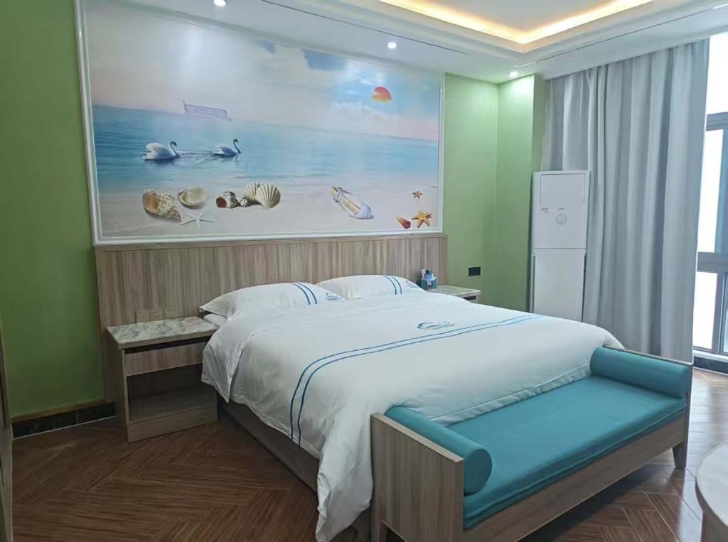 En eller flere senge i et værelse på Haimeng International Hotel