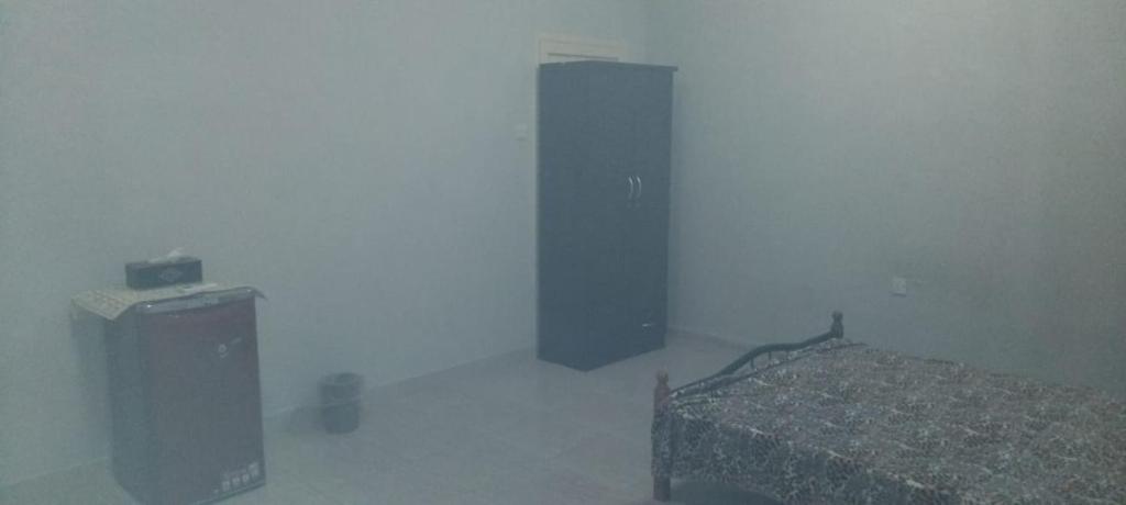 Ένα ή περισσότερα κρεβάτια σε δωμάτιο στο HOUSE IN AL AIN - 4