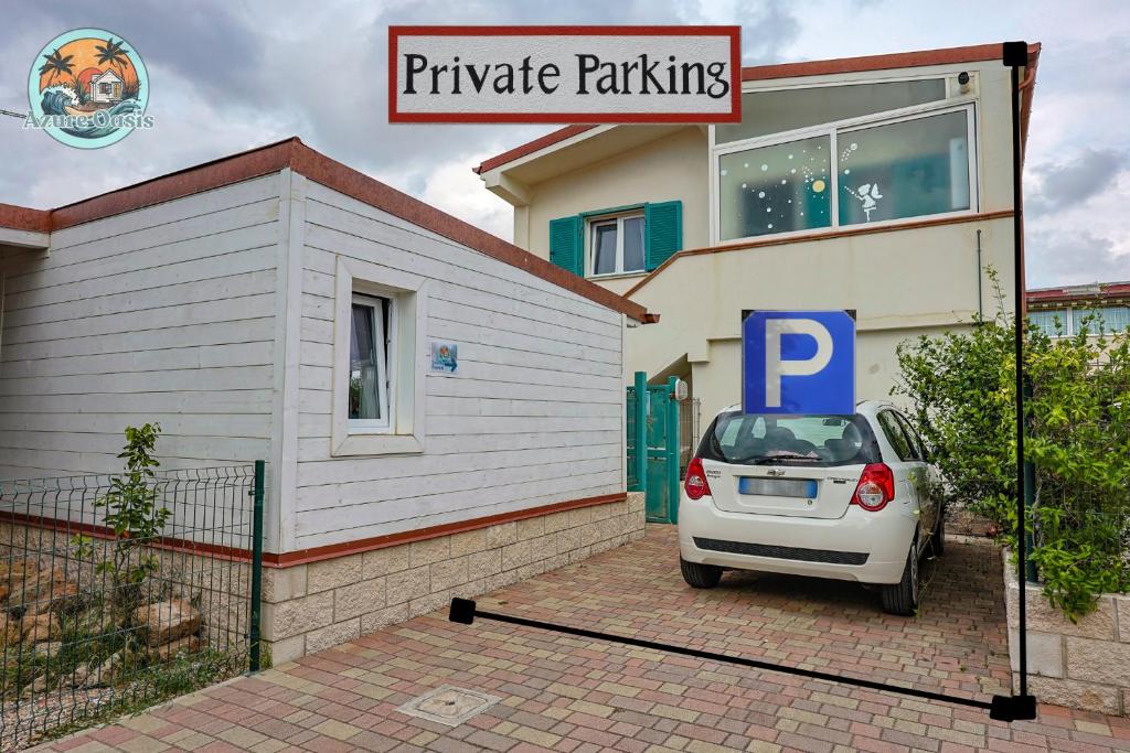 a white car parked in front of a house at Azure Oasis with parking near the airport & beach in Focene