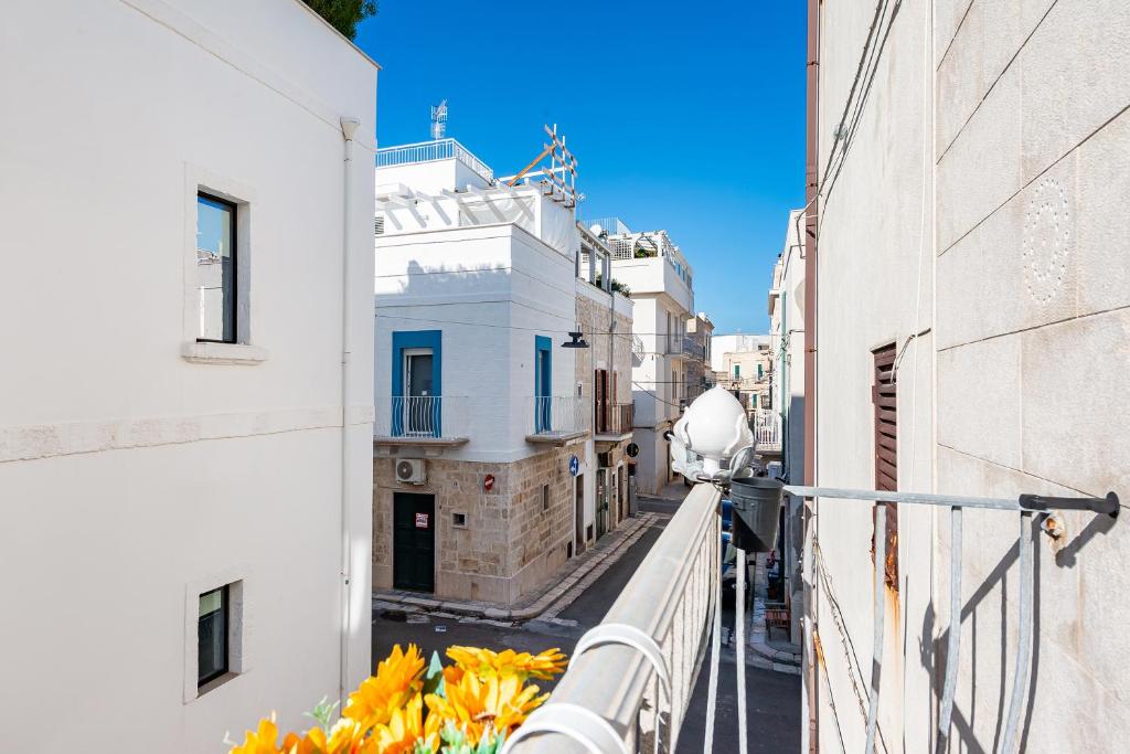 a view of an alley from a balcony of a building at Tresor 39 in Polignano a Mare