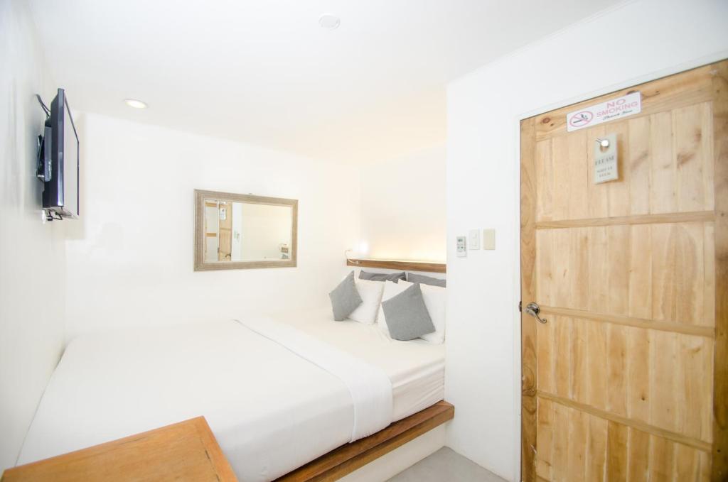 Postel nebo postele na pokoji v ubytování Zuzuni Boutique Hotel