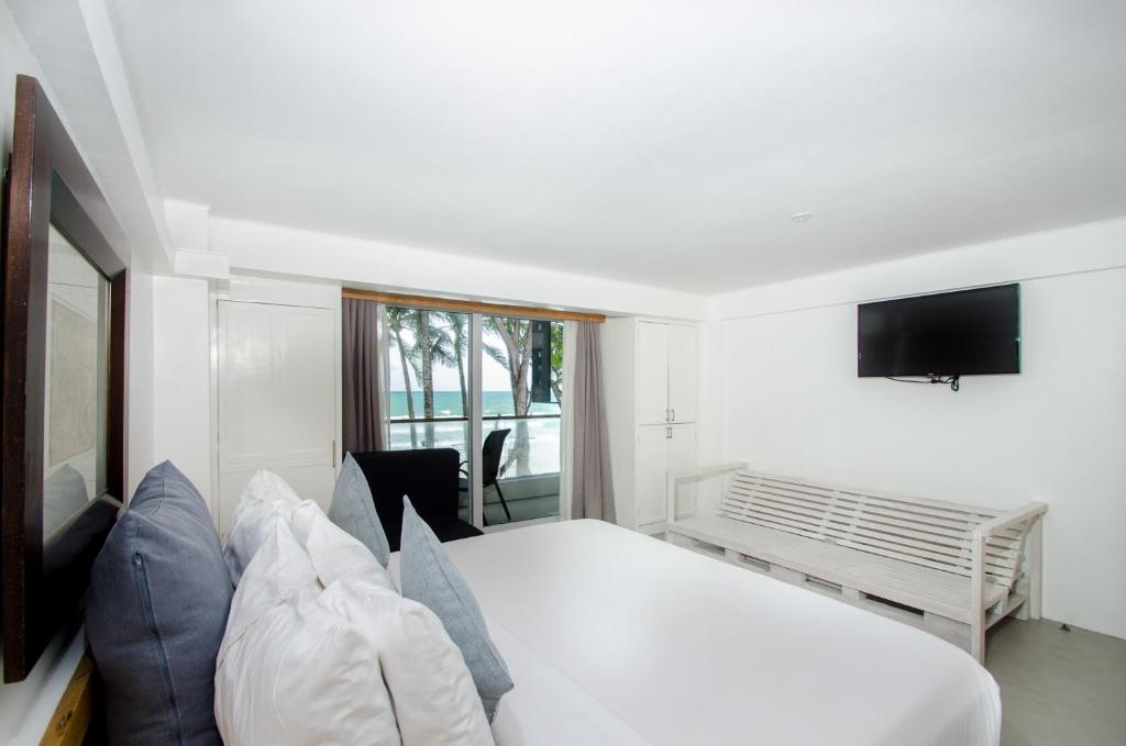 Postel nebo postele na pokoji v ubytování Zuzuni Boutique Hotel