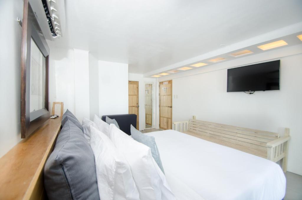 TV a/nebo společenská místnost v ubytování Zuzuni Boutique Hotel