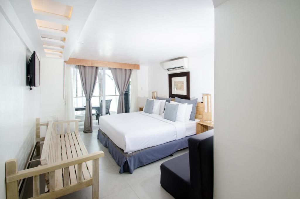 Postel nebo postele na pokoji v ubytování Zuzuni Boutique Hotel
